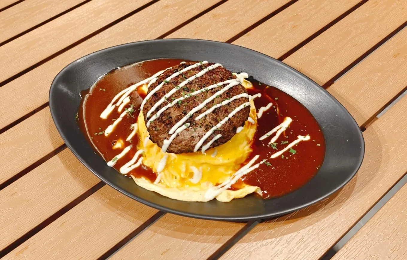 Beef Hamburg OmuRice — Angus patty over tornado egg in demi-glace